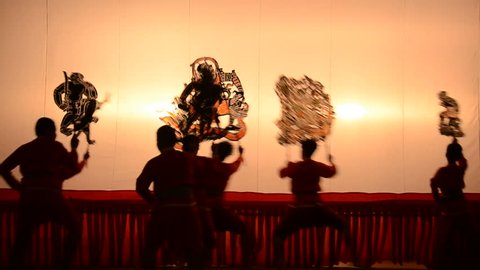 RATCHBURI, THAILAND - July 19 : Large Shadow Play is performed at Wat Khanon on July 19, 2014. Large Shadow Play or Nang Yai is a performing art 