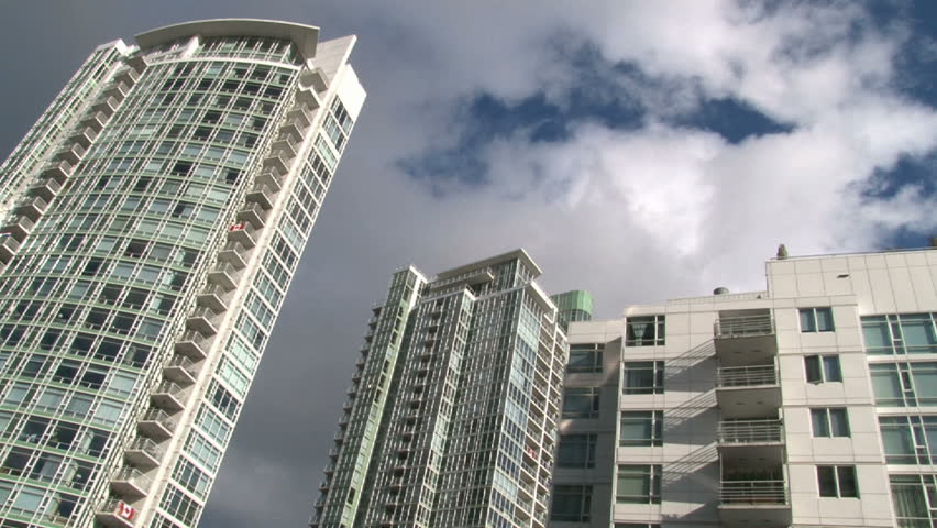 Time lapse of tall condominiums in Vancouver Canada during beautiful partly