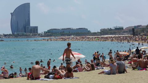 BARCELONA, SPAIN - JULY 15, 2014: View of Barceloneta Beach in summer. Barcelona, Spain. 
It is one of the most popular beach in Europe