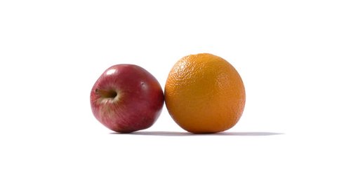 The saying "Comparing apples and oranges" means that the contrast between individual items is too great for them to be validly compared. An apple and an orange collide on a white background.