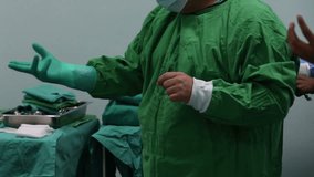 surgeon wearing protective gloves