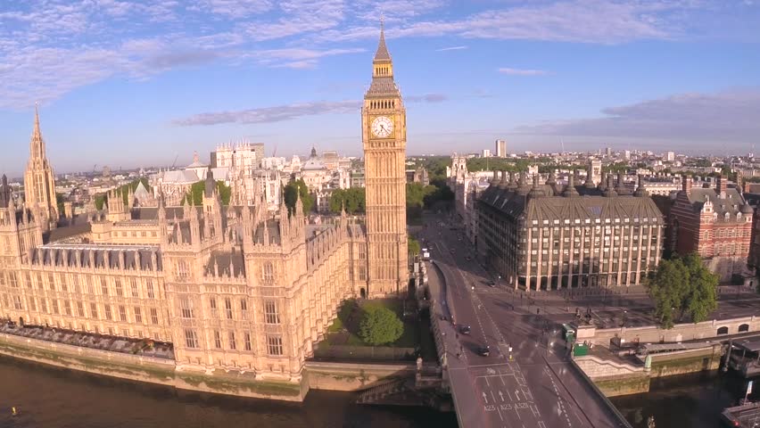 Aerial view of the famous landmark Big Ben and Houses of Parliament in London's city of Westminster, situated by the side of the river thames Royalty-Free Stock Footage #6928663