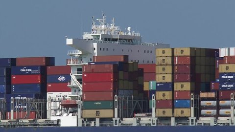 PORT OF ROTTERDAM - JULY 2014: Large container ship CMA CGM Amerigo Vespucci navigates, bound for Rotterdam - close up bridge. The Eurogeul allows deep-water sea access to the Port of Rotterdam.