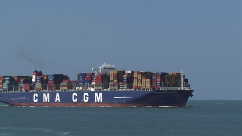 PORT OF ROTTERDAM - JULY 2014: Large container ship CMA CGM Amerigo Vespucci navigates on Eurogeul, North Sea, bound for Rotterdam. The Eurogeul allows deep-water sea access to the Port of Rotterdam.