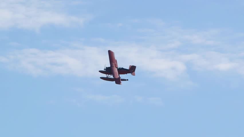 Red Baron biplane flying through the sky