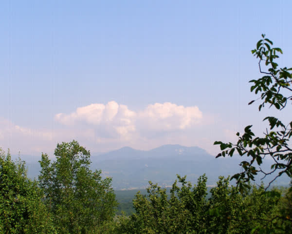 clouds running over the mountain