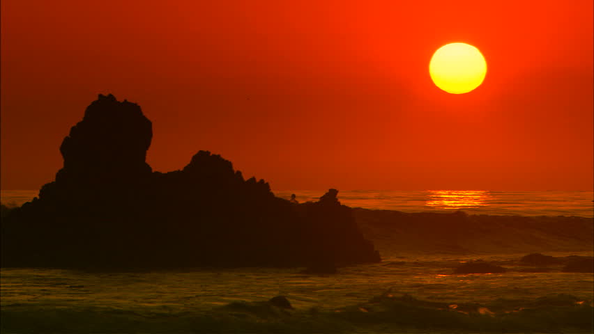 A stunning beach sunset scene.  Great depiction of California, Hawaii, or any