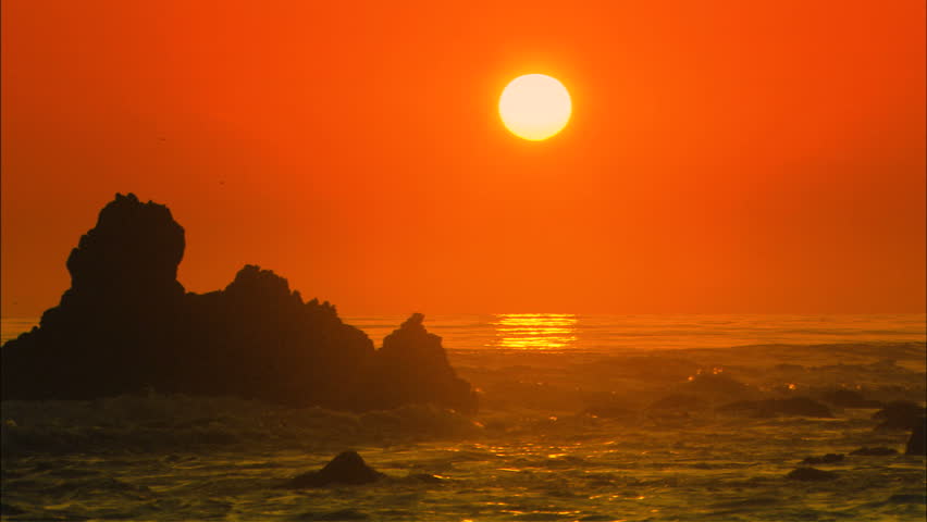 A stunning beach sunset scene.  Great depiction of California, Hawaii, or any