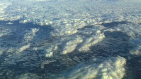 Flying above the clouds in winter. Actual high altitude footage.