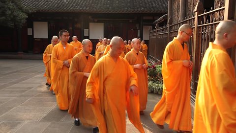 CHENGDU, CHINA - AUG 24: Monks enter Wenshu Temple after their daily procession, Chengdu, China, August 24, 2009.