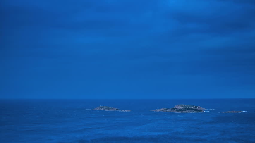 Time lapse of clouds moving over the sea. Magic rays of light.