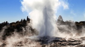 Slow motion: The Pohutu Geyser (right) and Prince of Wales Feathers Geyser (left, smaller) erupting at Whakarewarewa Thermal Park, Rotorua, New Zealand - one of NZs top tourist attractions. Wide.