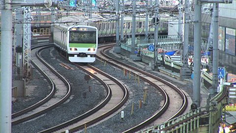 TOKYO, JAPAN - CIRCA 2010: Commuter train passes at Ueno Train Station in Tokyo