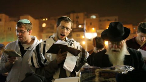 JERUSALEM, ISRAEL â€“ SEP 18: Midnight prayers are reciting Slihot (penitential prayers) and imploring until Yom Kippur at the Western Wall, September 18, 2009.