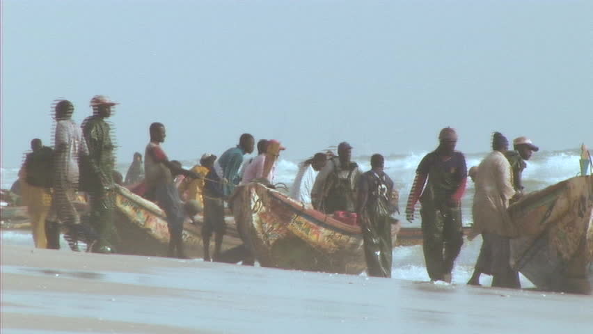 Fisherman in africa pulling in canoe