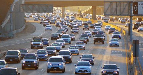 Cars driving in traffic jam on 405 freeway in Los Angeles, California. 4K.