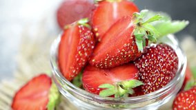 Portion of fresh Strawberries (loopable full HD video)