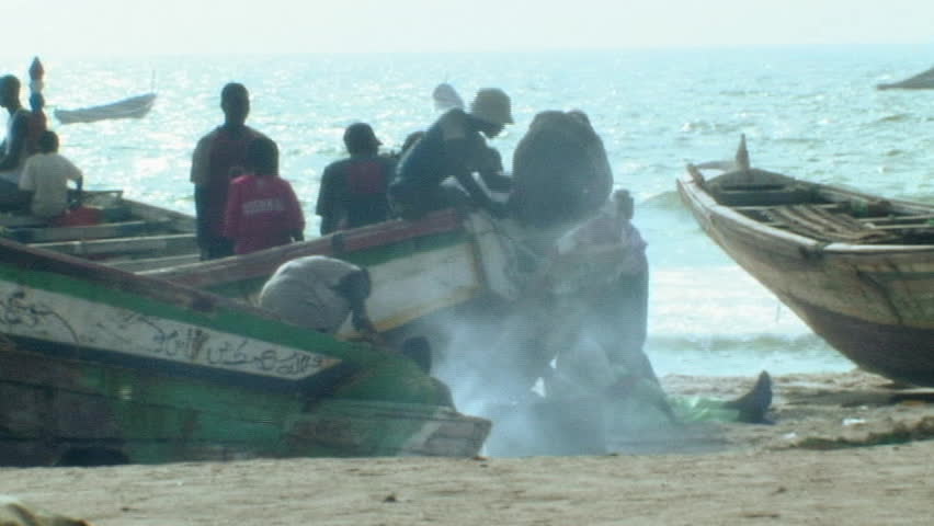Fisherman smoking catch in africa