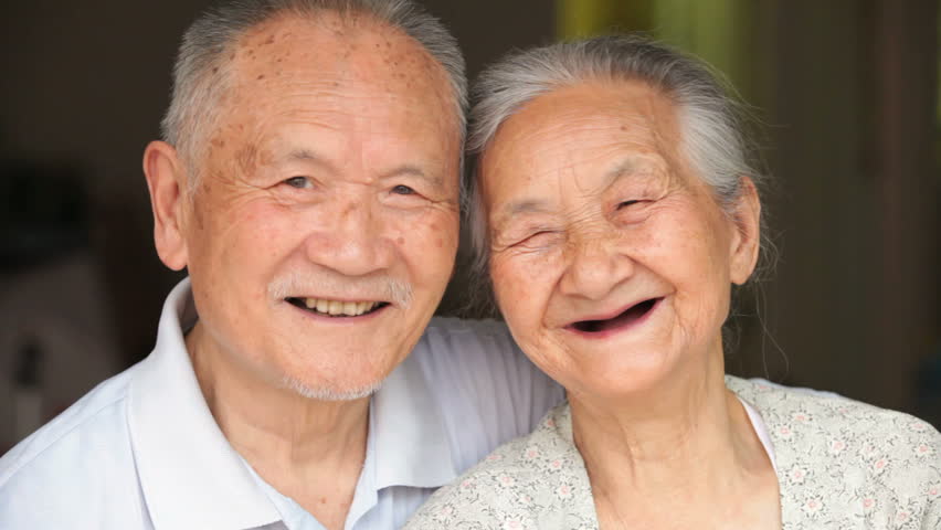 Happy senior asian couple together looking at camera smile | Shutterstock HD Video #6986434