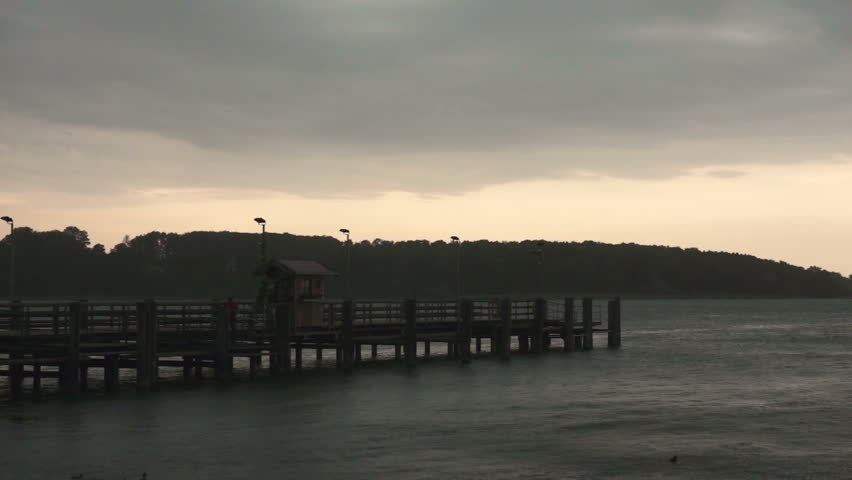 wooden pier on big lake in germany during a storm
