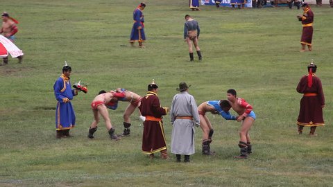 Ulaan Baatar, Mongolia - July 11: Wrestlers fight during the opening ceremony of the 2009 Naadam Festival, Mongolia