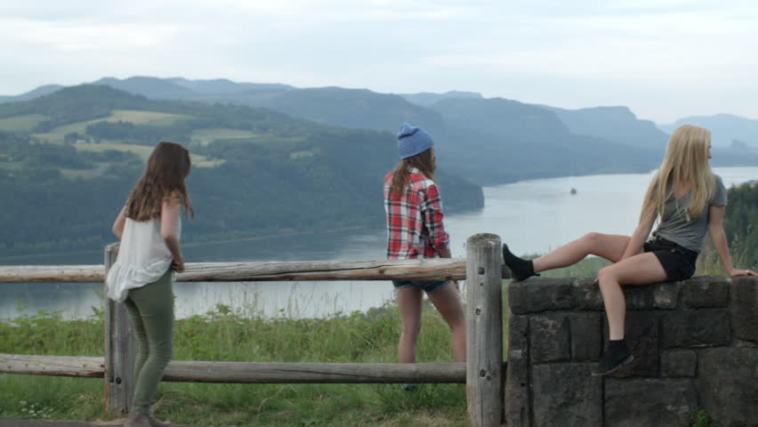 Girls Hang Out At A Rest Stop With A Scenic View, They Dance, Climb, Sit And Take A Break From Road Trip