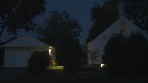 Driving plate, side view, night.  Tree-lined road through well-tended middle class suburban neighborhood with 1940s & 1950s era Cape Cods, bungalows and similar homes.  Recorded on Tyler Mini Gyro. 