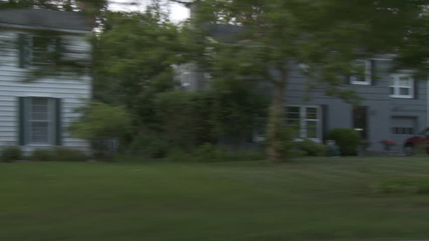 Driving plate, side view, day time.  Affluent upper middle class neighborhood with 1930s & 1940s era wood-frame and brick-built homes.  Camera mounted on Tyler Mini Gyro.