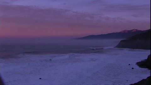 At sunrise we are given the vista of the rolling mountain cliffs in Big Sur painted pink where California hits the Pacific