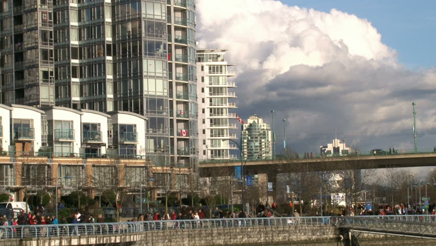 Time lapse of very busy water front and high rise buildings in Vancouver,