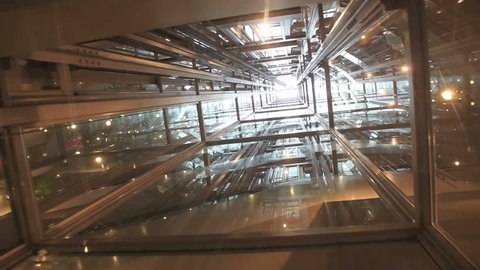 Ride in a transparent glass elevator going up