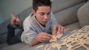 Child making mounting a car model at home