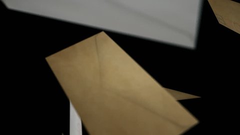 A collection of letters falling randomly down passed the camera on an isolated dark background