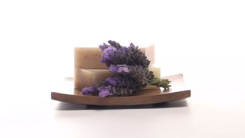 Herbal soap and fresh lavender on tray isolated on white zoom V1