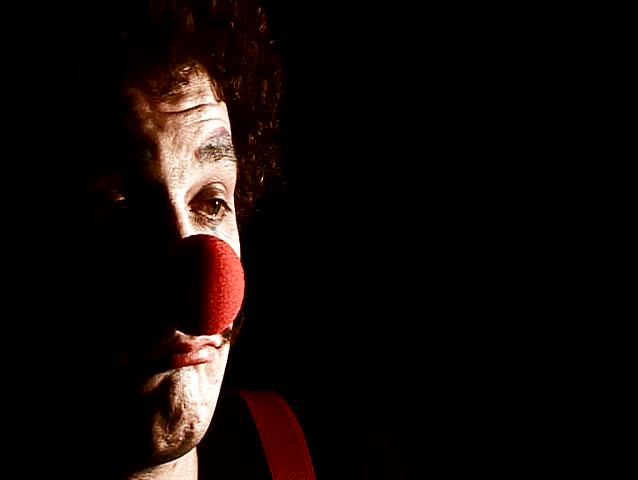 portrait of sad displeasure make up clown