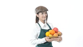 Smiling waitress holding fruits