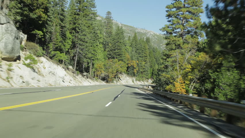 Driving east in the northern California Sierra mountains on California State Highway 50 on an Autumn day.