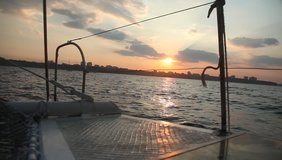View from deck of a yacht on the sea in sunset time 