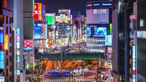 TOKYO, JAPAN - MARCH 19, 2014: Shinjuku district illuminated at night. The district is a renown night life center.