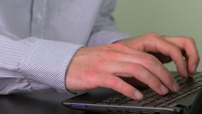 Typing on a laptop computer PC device.

This video clip was shot in 4K Ultra High-Definition and offers four times the resolution of Full HD