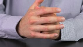 Hands of a businessman praying.

This video clip was shot in 4K Ultra High-Definition and offers four times the resolution of Full HD.