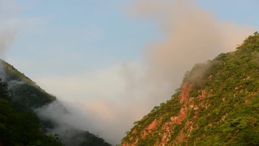 Time Lapse Of Cloud Forming On Steep Mountain In The Morning in Bolivia 