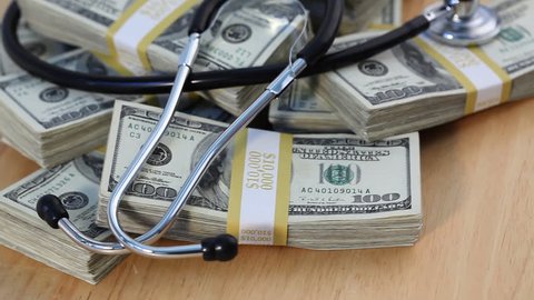 Stethoscope on Piles of Cash -  1920x1080 HD.
