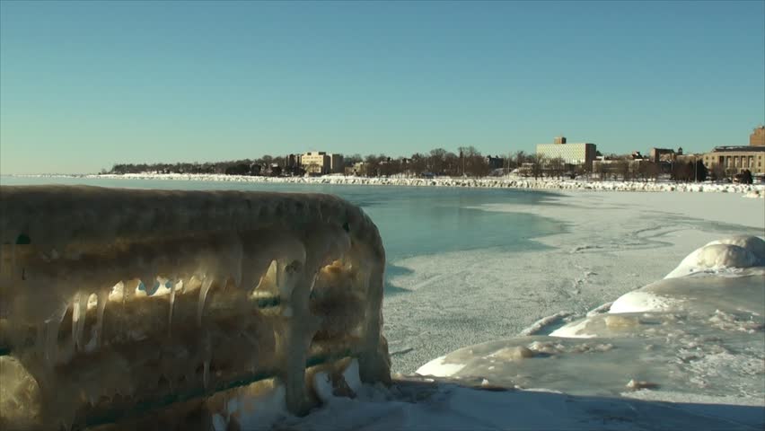 Panning left to right of frozen lake shore in Racine, Wisconsin.