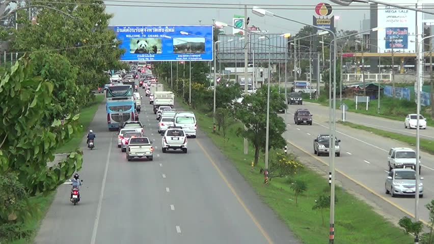 Chiangmai, thailand- august 13 2014: traffic in the chiangmai-lampang  highway. footage at road no.11 about 5 km from city, chiangmai province,  thailand.
