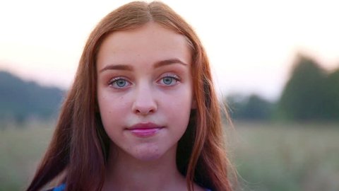 Portrait of a young, beautiful girl. Young girl smiling at the camera. Person showing emotion.Nature walk. Person, people, woman, girl, emotion, nature, beauty, youth, look, smile,blue eyes.