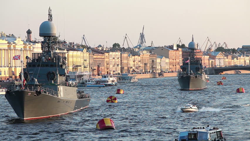 Camera zoom out from military ships on Neva river, Saint-Petersburg, Russia. Day of the Russian Navy
