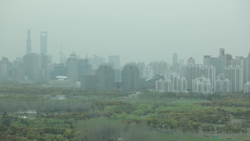 Shanghai skyline with fog. HD China Citiscapes. Circa 2013.