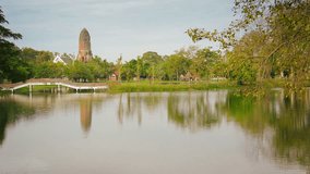 Video 1080p - Park with pond and the ruins of ancient temples. Thailand. Ayutthaya