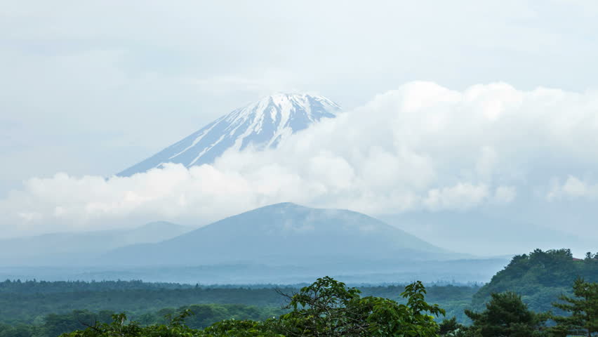 Mount Fuji behind clouds, Japan